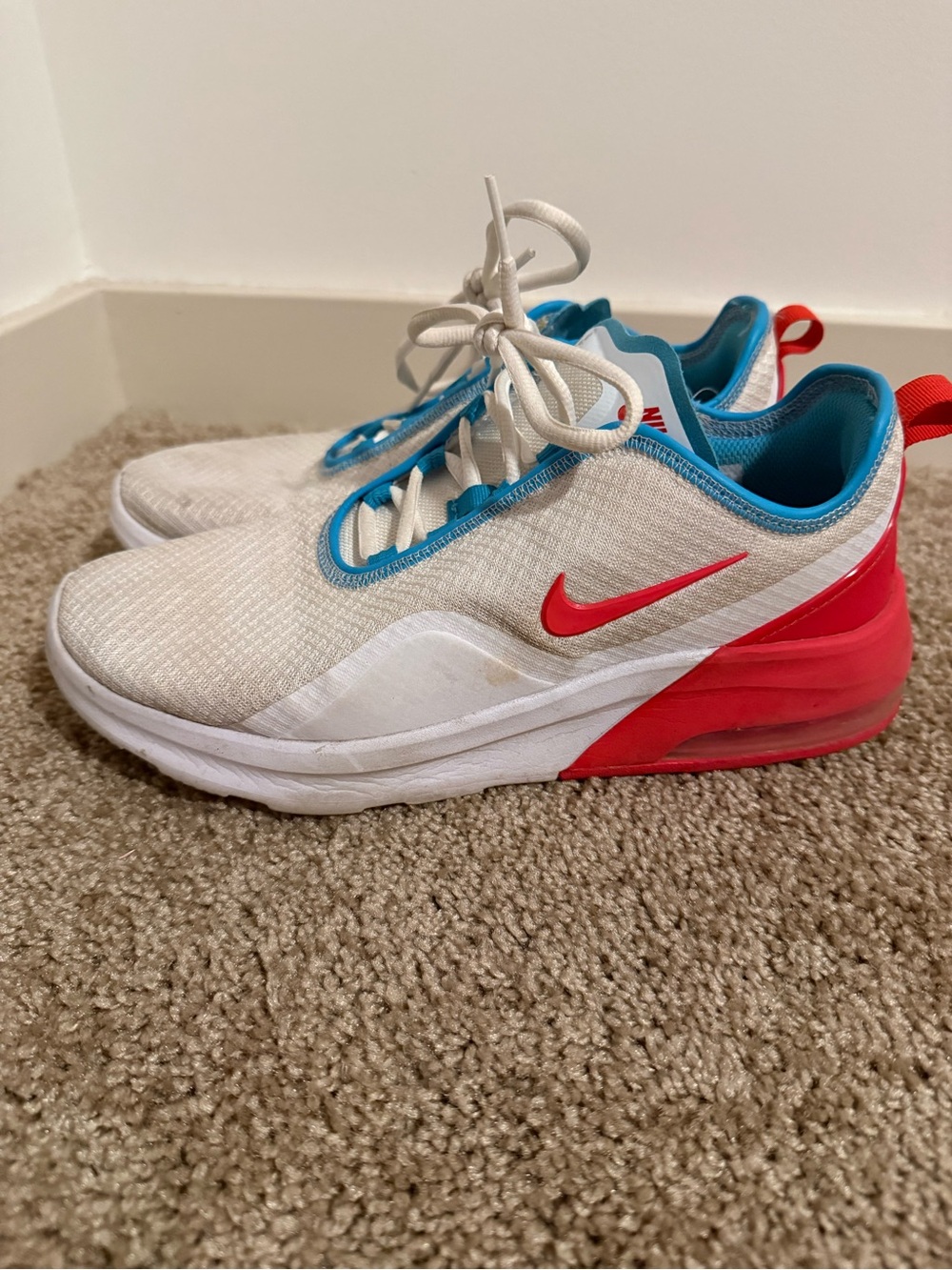 Nike Woman’s White Sneakers with Red Swoosh and Blue Trim